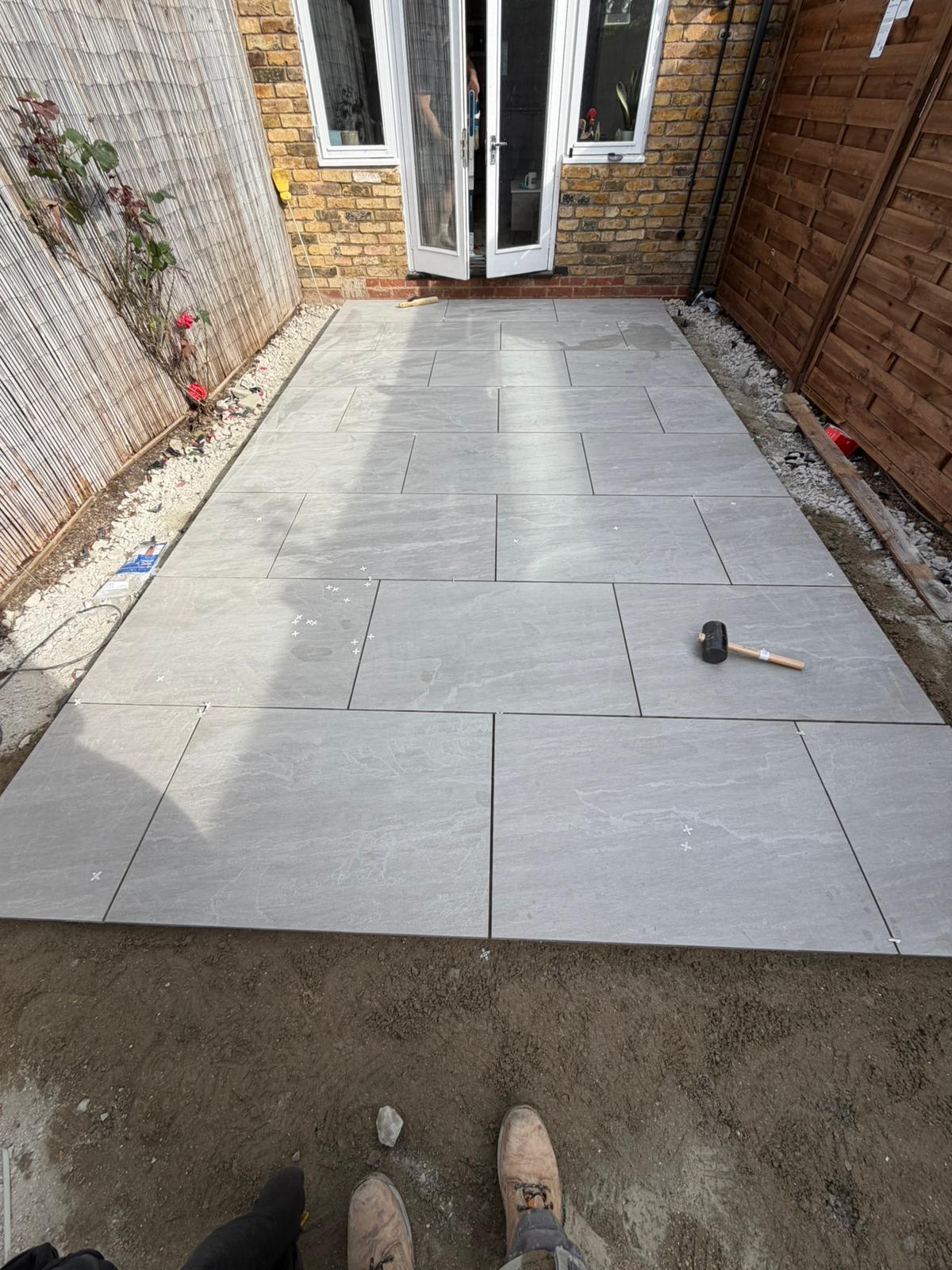 Porcelain patio being laid in Battersea garden SW11