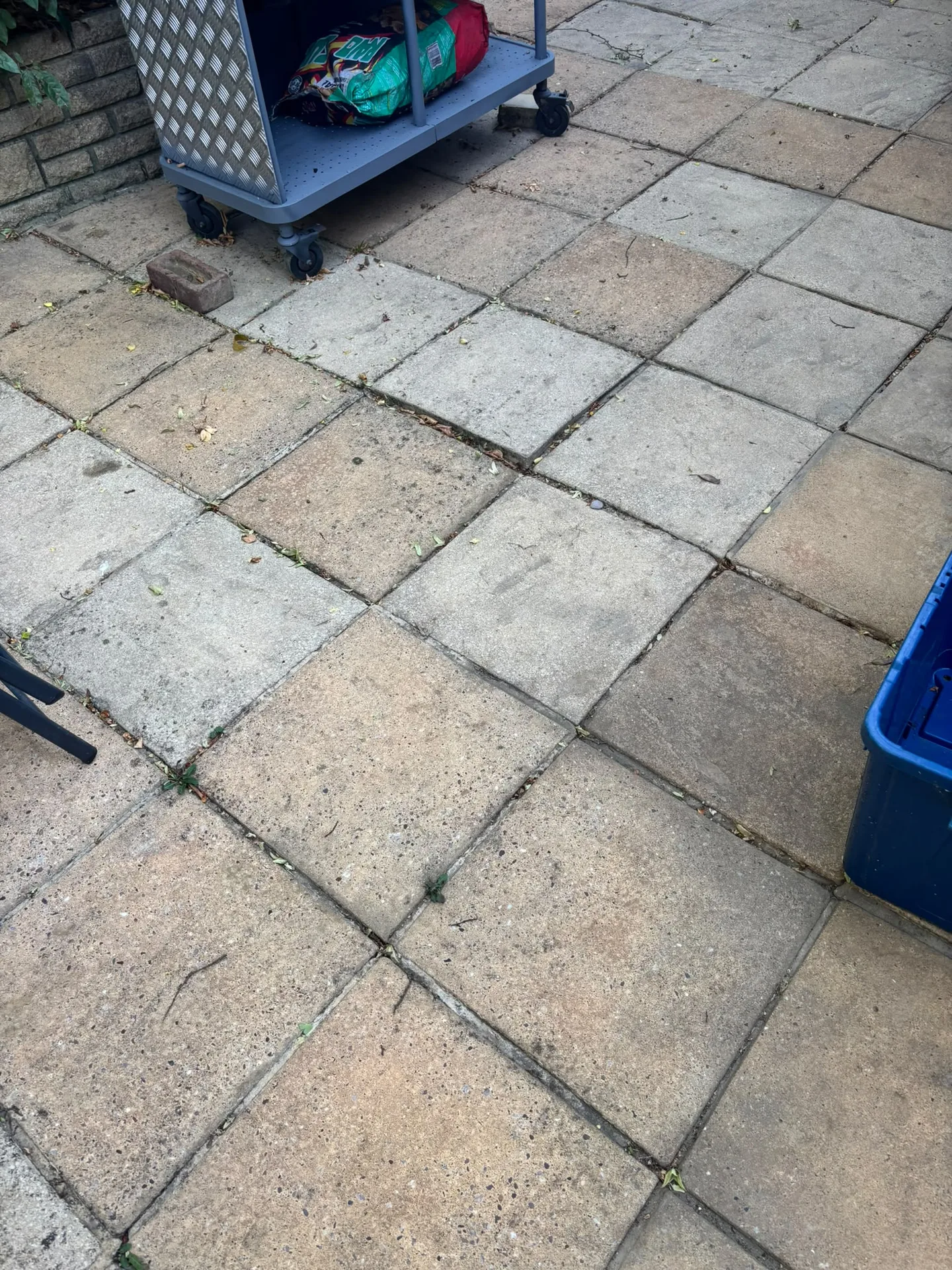 Pressure washed patio slabs restored to a consistent light colour in Woodford, IG8 9JN