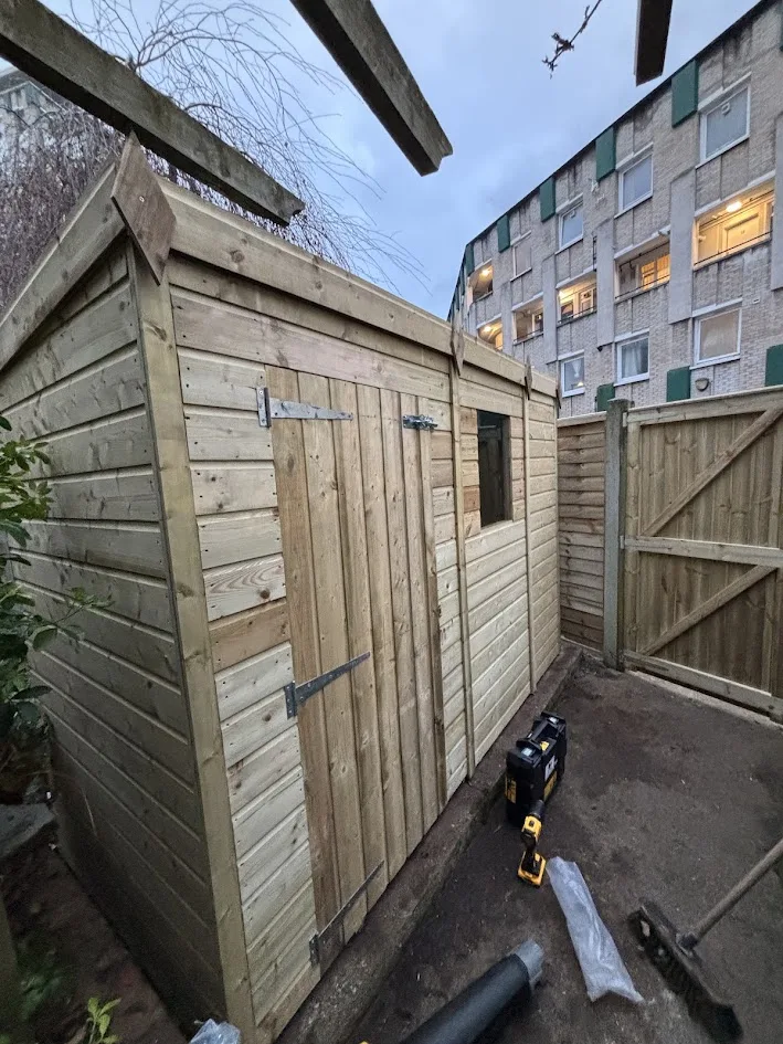 Completed new pressure-treated timber shed installation