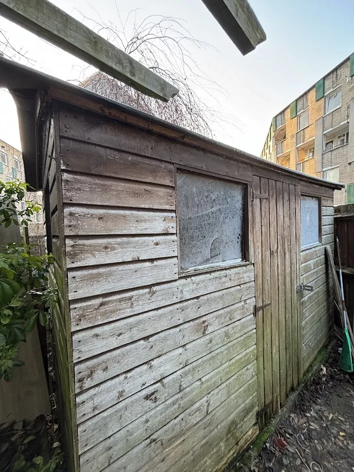 Old rotten timber shed before removal, South East London